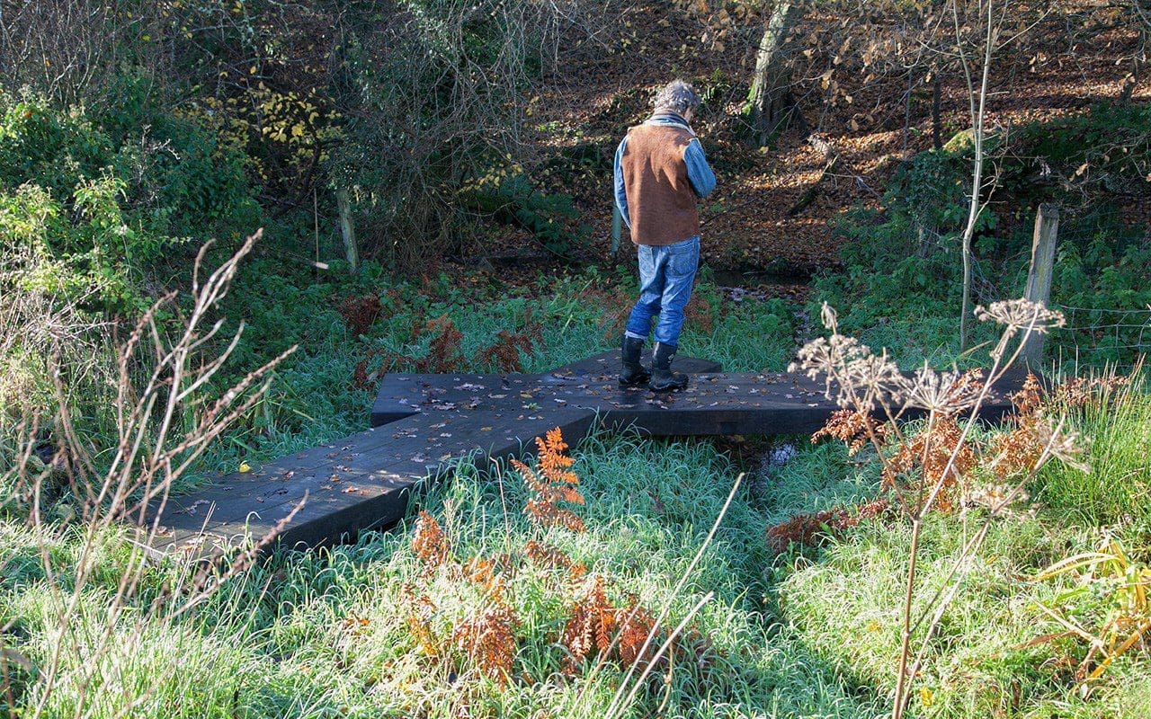 Dan Pearson on the new bridge at his Somerset property. Photo: Huw Morgan